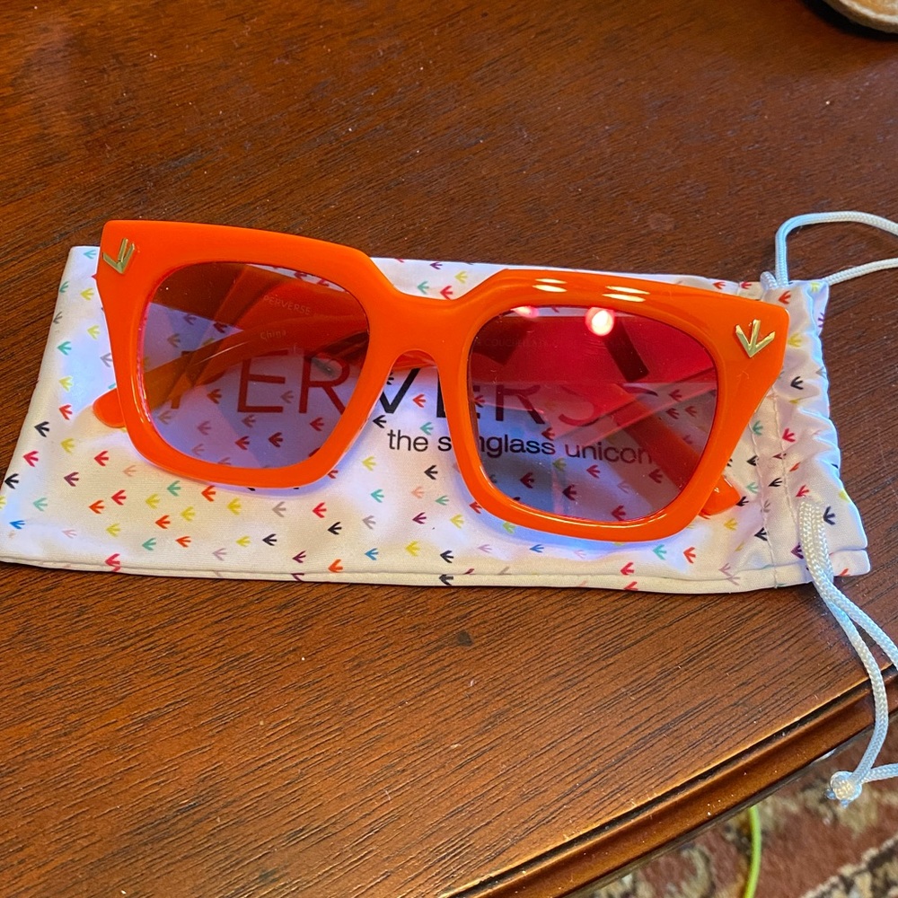 Perverse orange sunglasses and cleansing clothcase